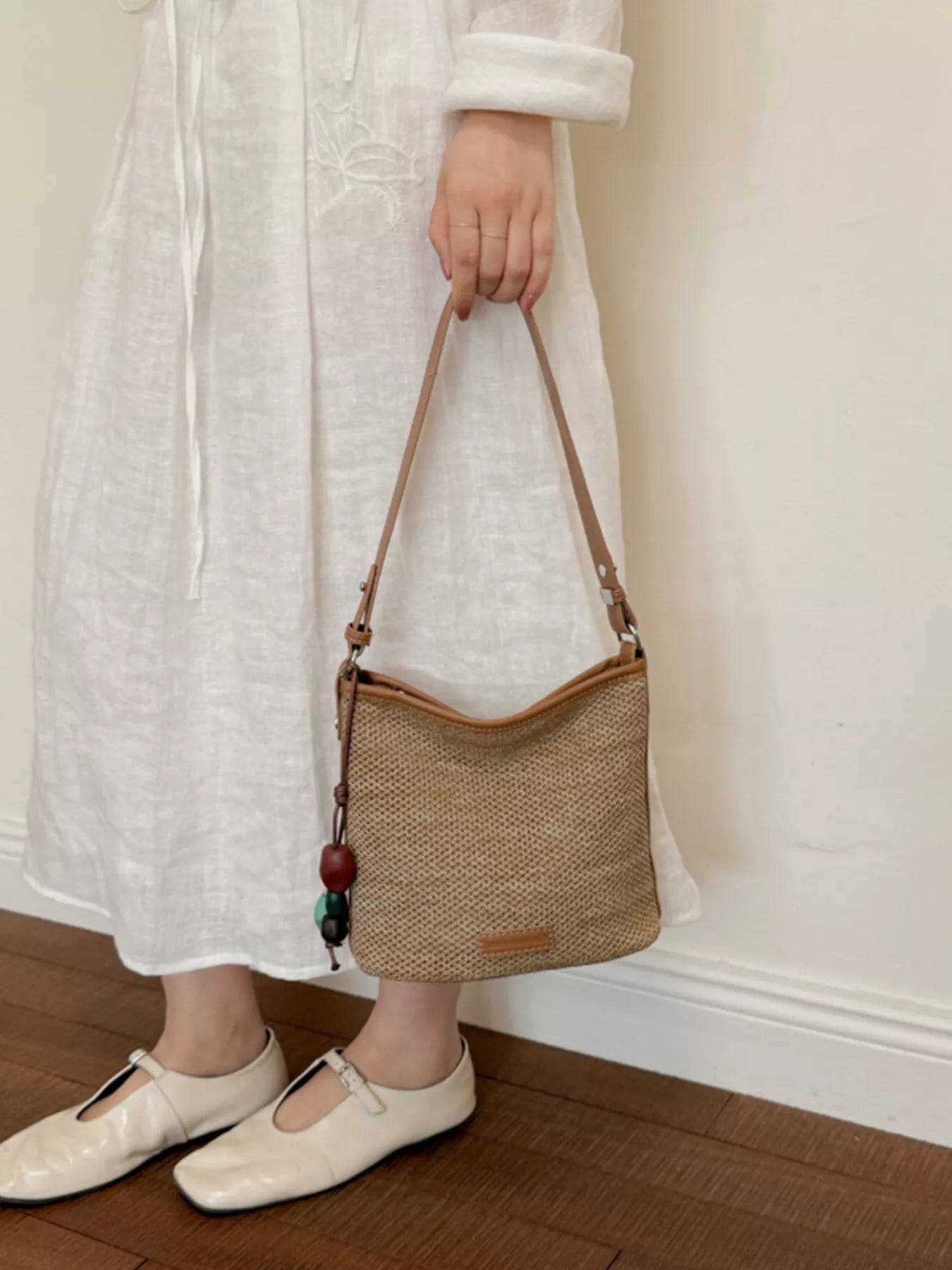 Straw Crossbody Bag with Leather Trim and Tassel Charm