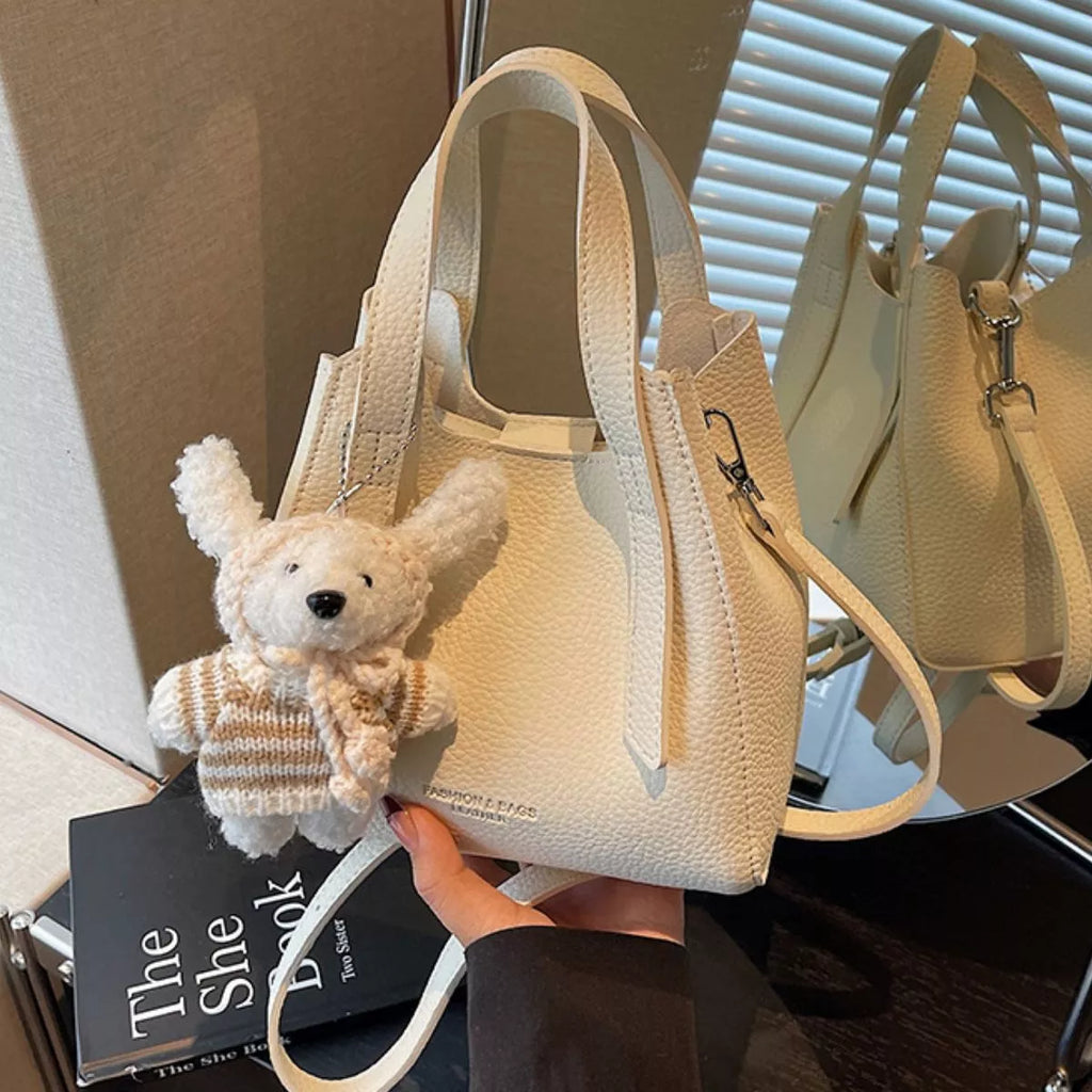 Chic Textured Leather Crossbody Bag with Adorable Charm