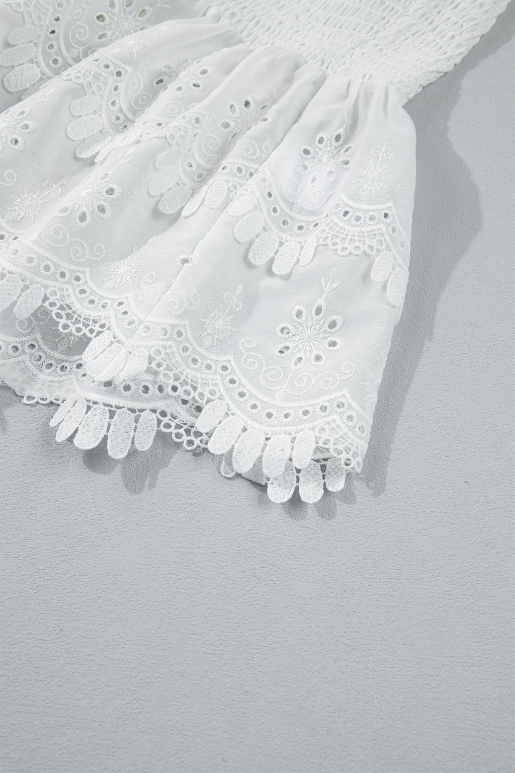 White Sleeveless Smocked Lace Peplum Top