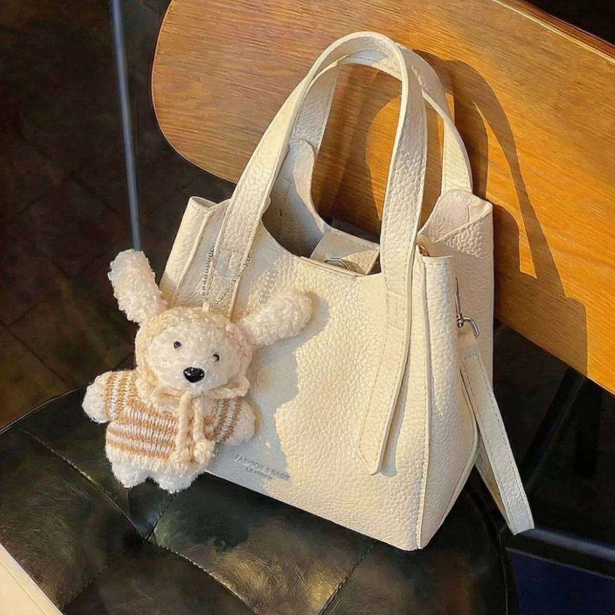 Chic Textured Leather Crossbody Bag with Adorable Charm