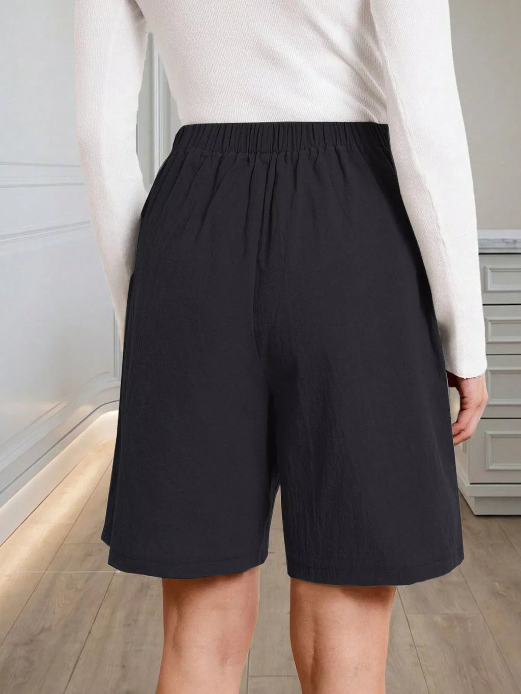 High-Waisted Pleated Shorts with Button Detail