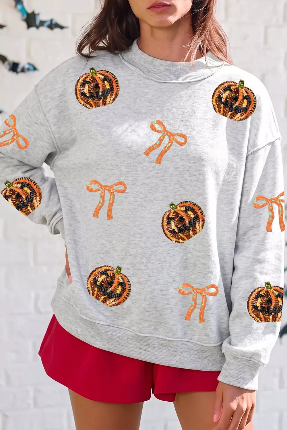 Sequin Pumpkin Face Bow Exposed Seam Halloween Sweatshirt