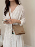 Straw Crossbody Bag with Leather Trim and Tassel Charm