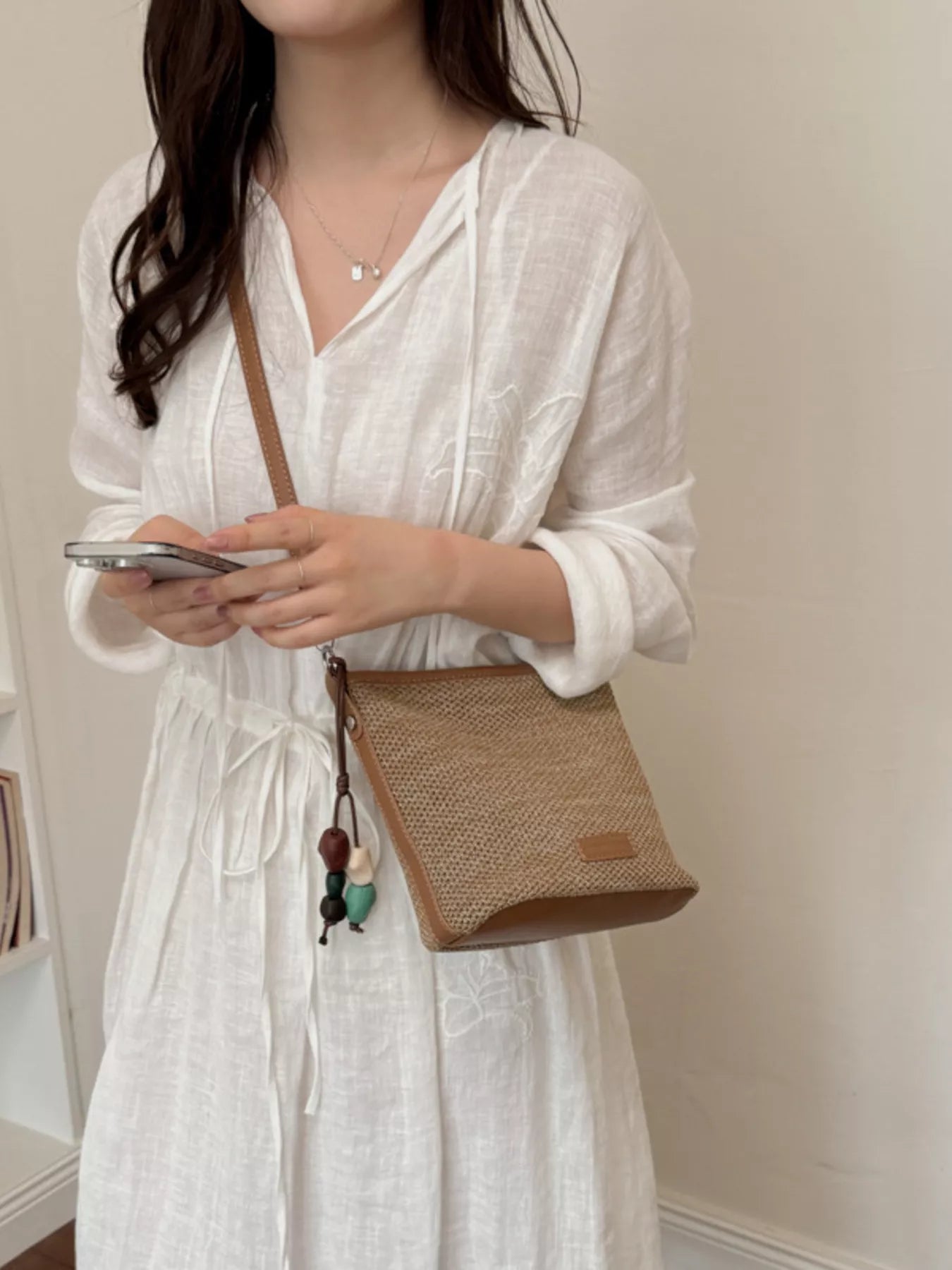 Straw Crossbody Bag with Leather Trim and Tassel Charm