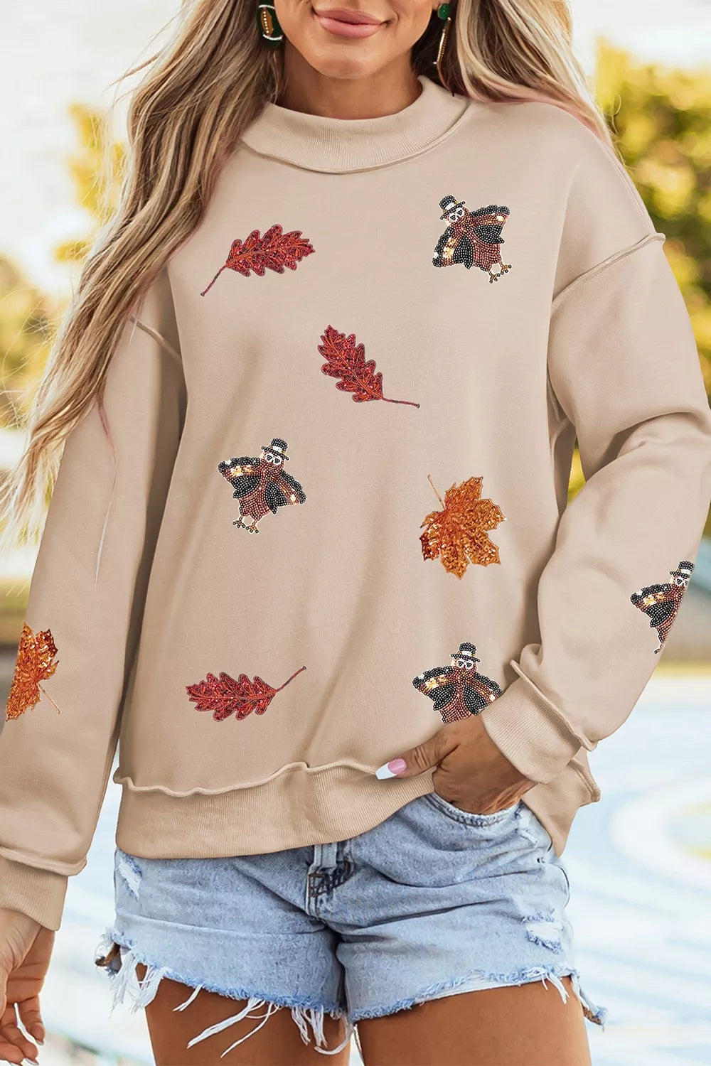 Sequin Turkey Leaf Graphic Exposed Seam Mock Neck Sweatshirt