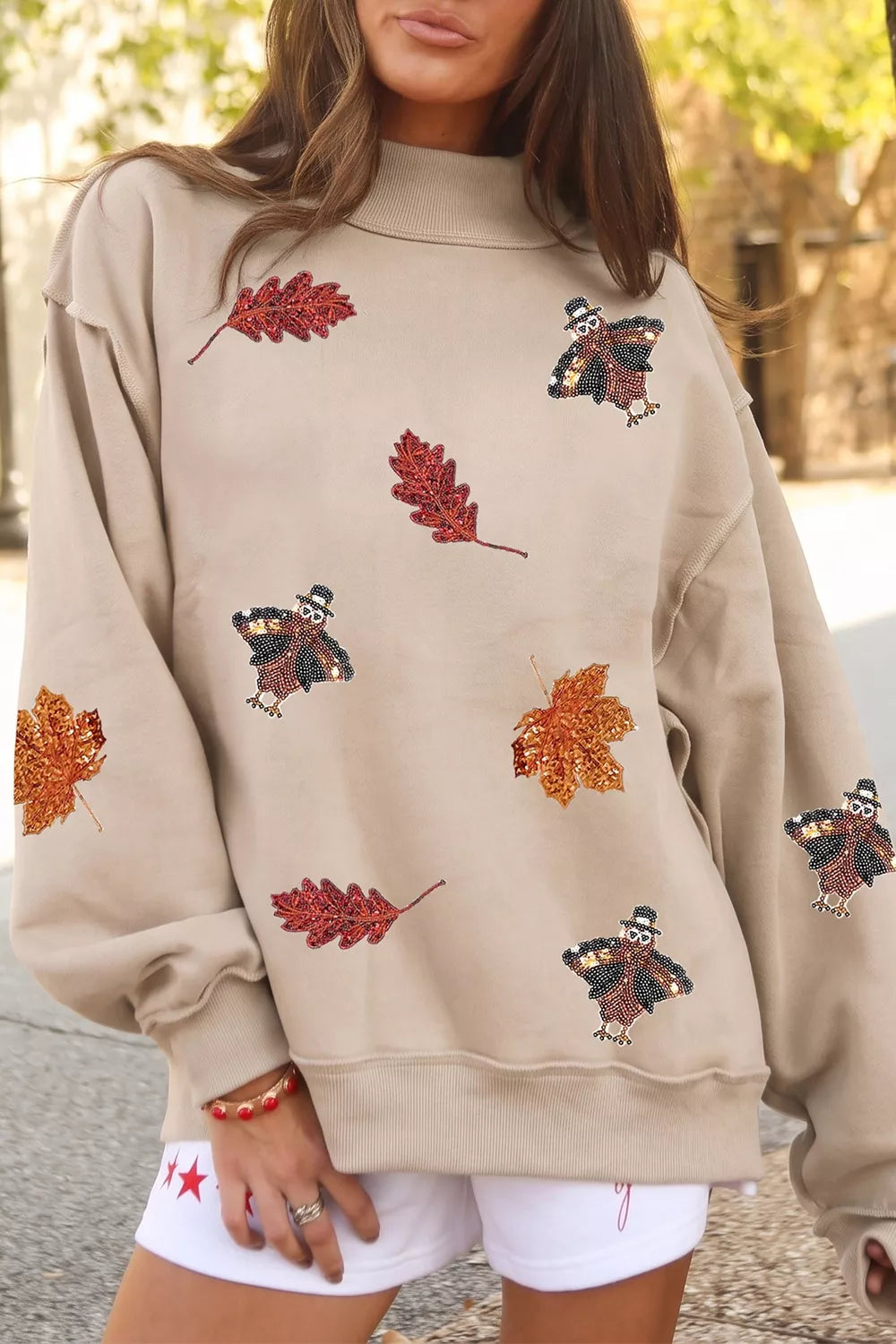 Sequin Turkey Leaf Graphic Exposed Seam Mock Neck Sweatshirt