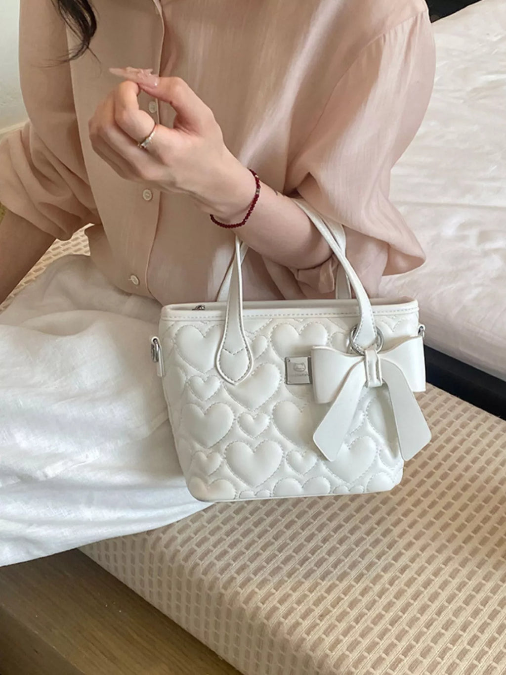 Chic Quilted Heart Crossbody Bag with Bow Accent