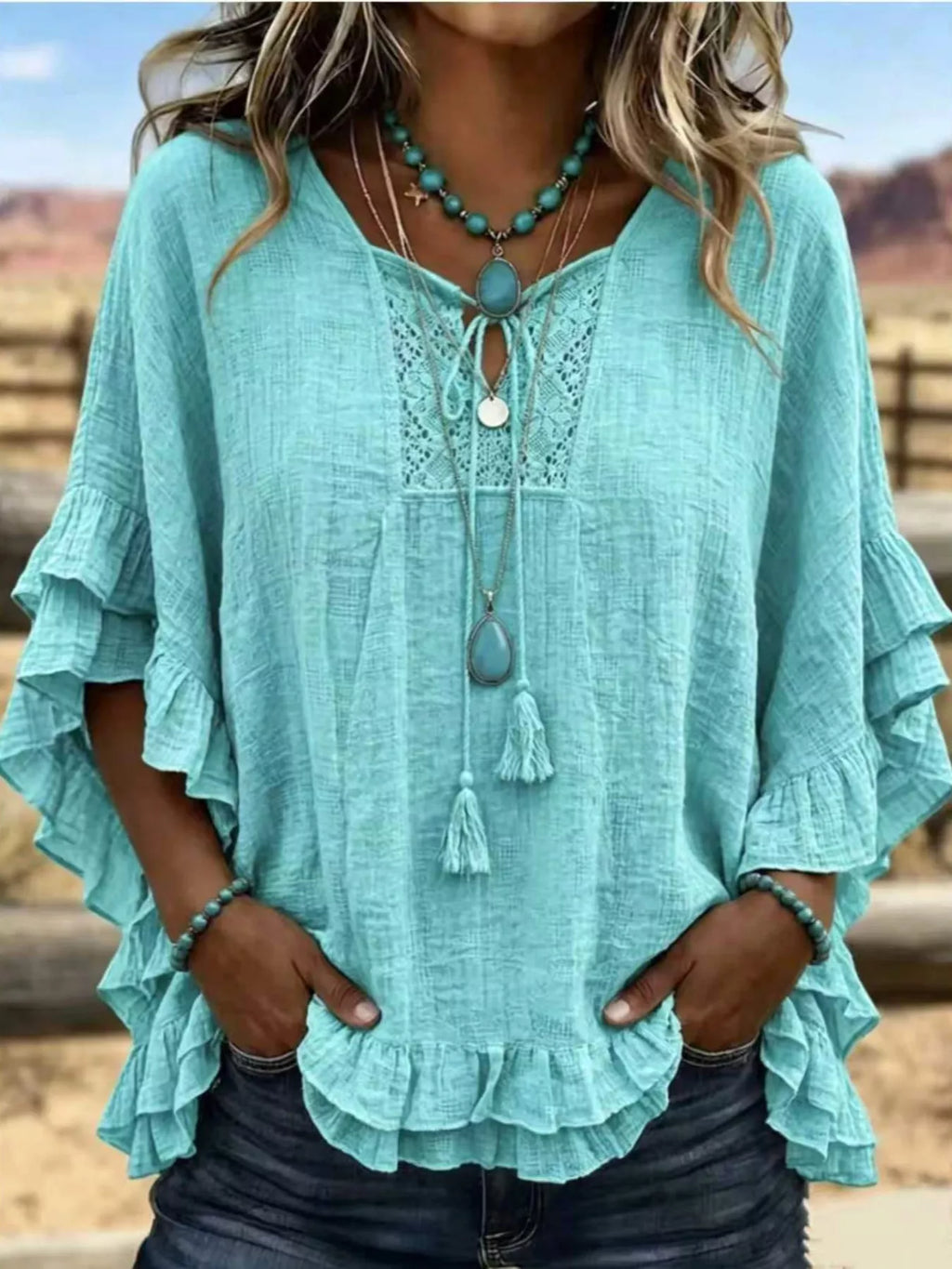 Full Size Tassel Tie Neck Ruffled Hem Blouse Plus Size