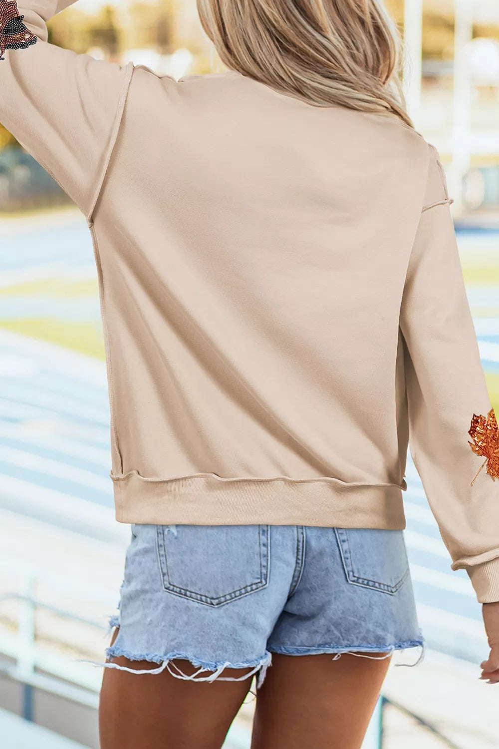 Sequin Turkey Leaf Graphic Exposed Seam Mock Neck Sweatshirt